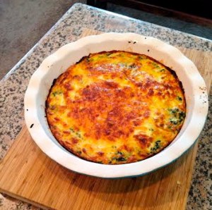 Crustless quiche made with eggs, almond milk, spinach, red bell pepper, onion, and  thin layer of mozzarella cheese.